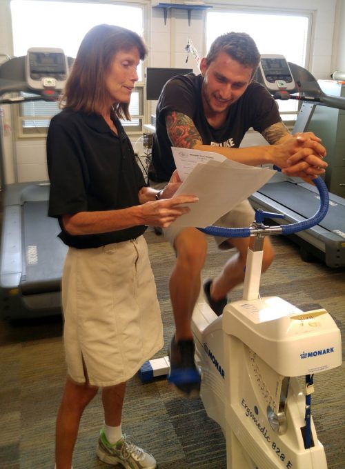 Dr Robinson in the HPPE Lab working with a student.