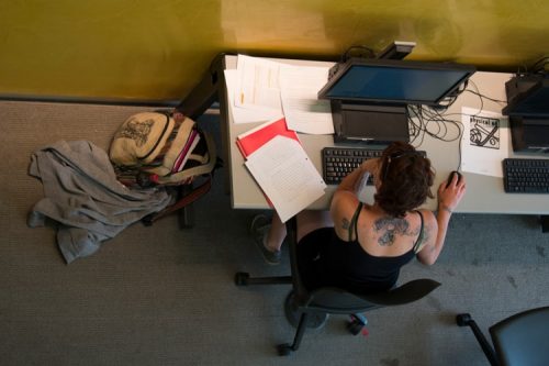 Student in computer lab writing a paper